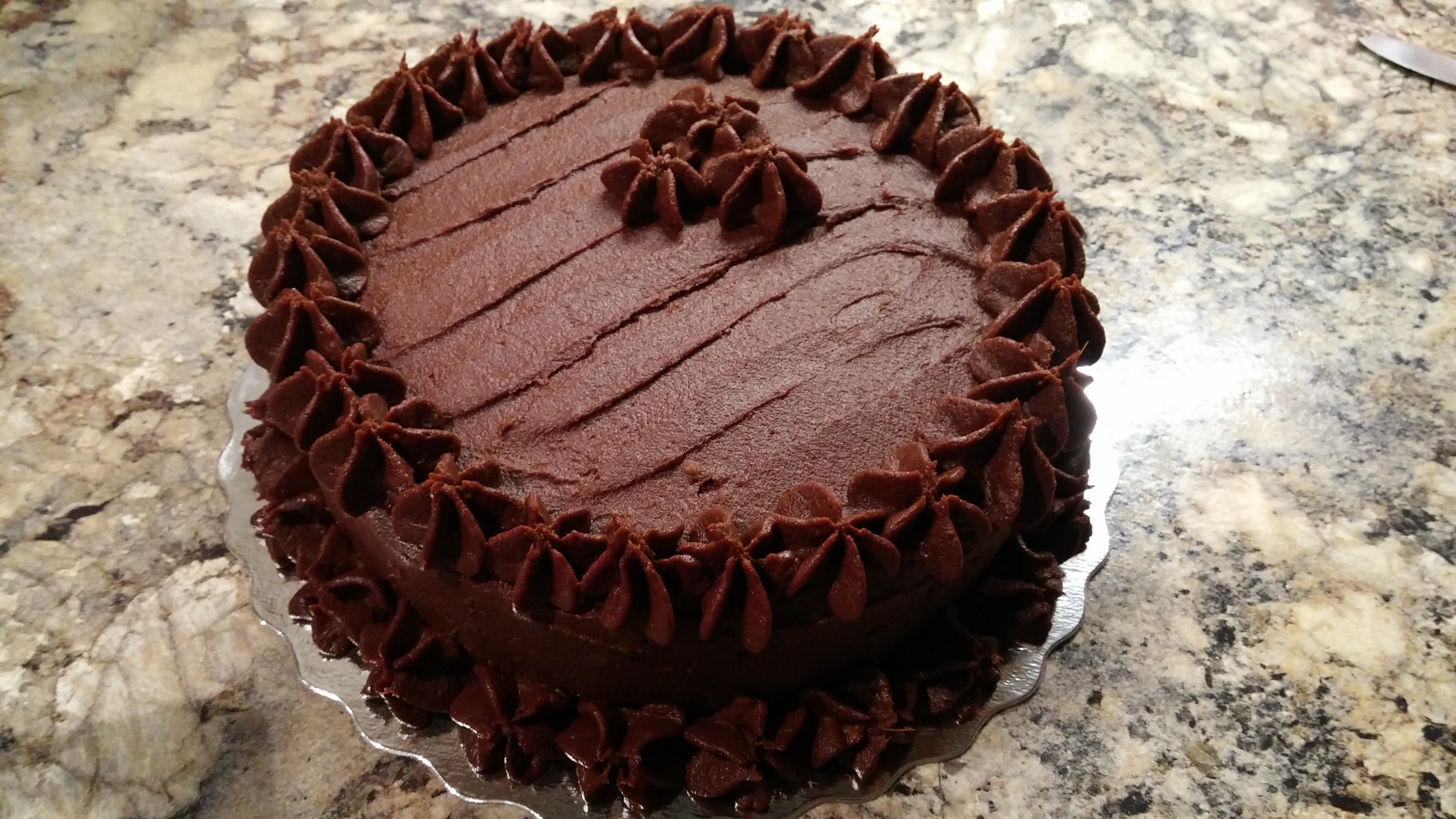 Chocolate cake with chocolate icing. 
Naturally Dairy free. 
Aslo available in glutne free and or vegan options (Non certified)